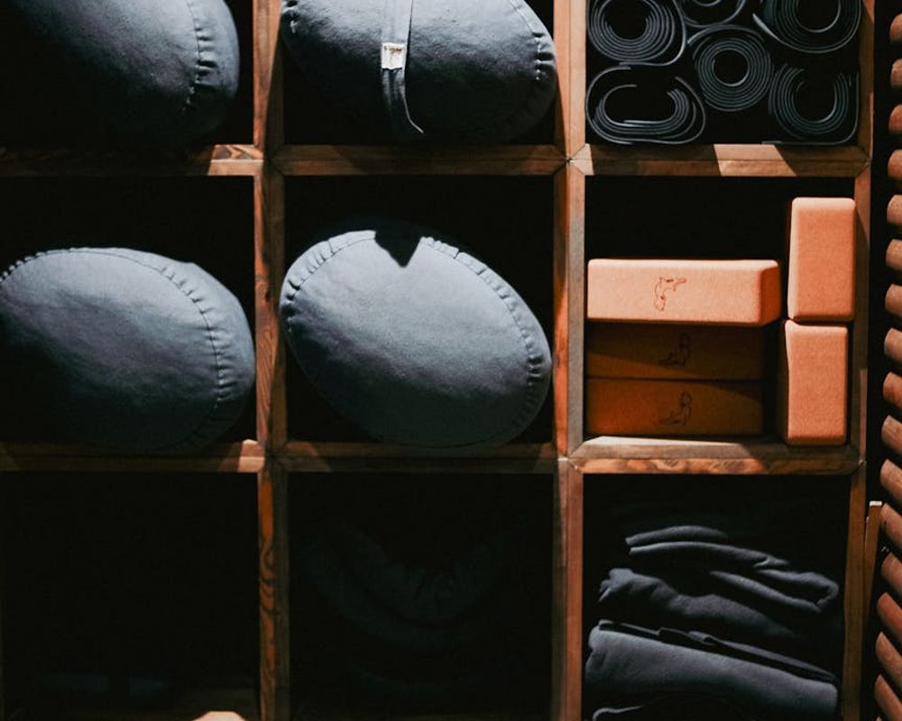 Modern fitness equipment arranged neatly on a dark floor.