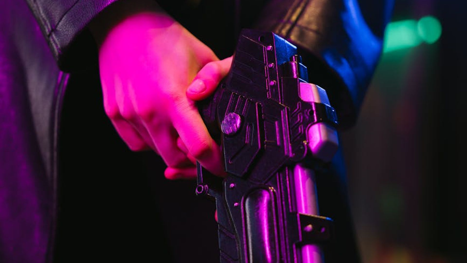 Person running in a high-tech gym with neon lights.